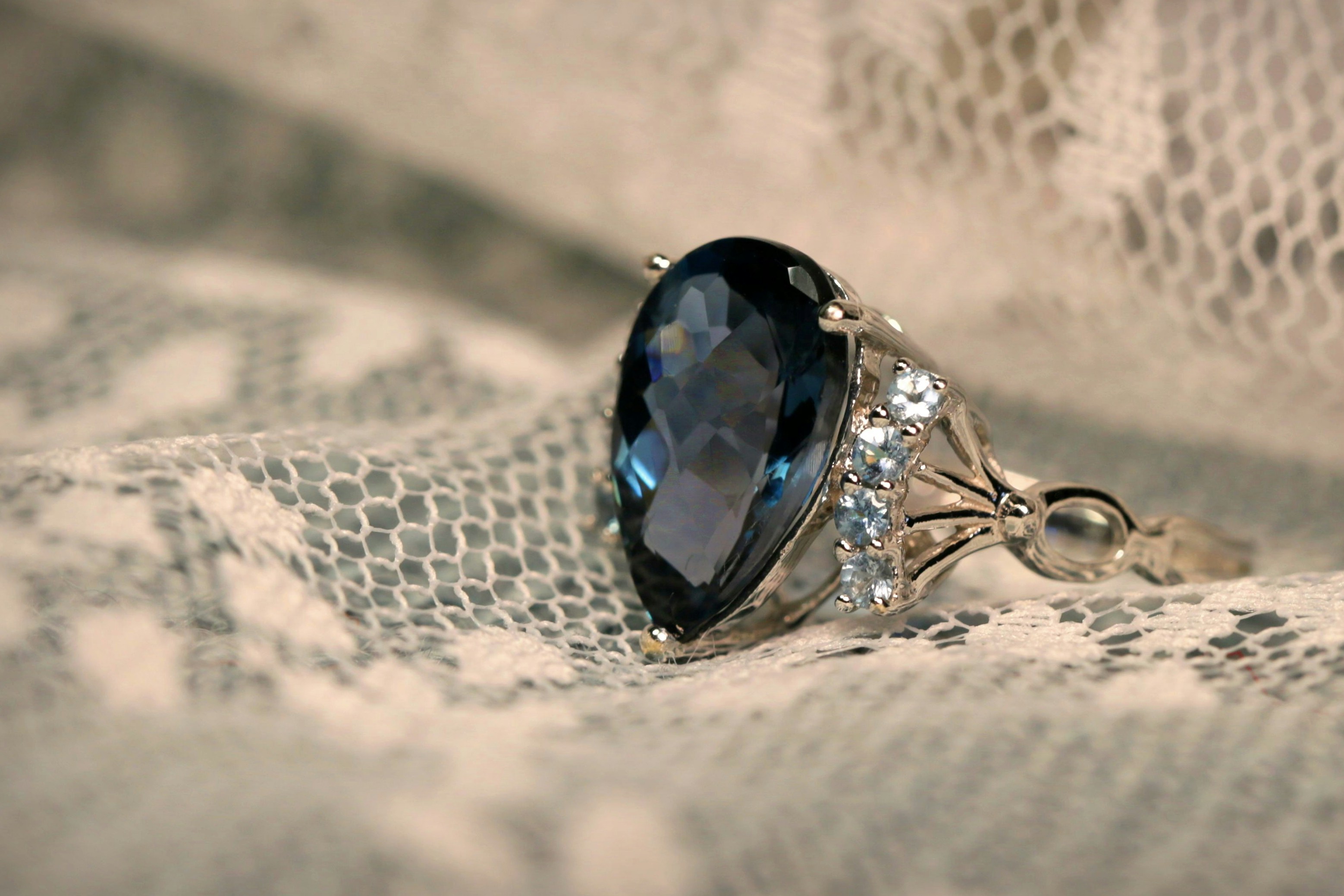 Sapphire engagement ring on lace from Strong Gold